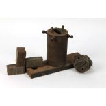 A vintage fishing spoon press, with three blocks for different patterned scales,