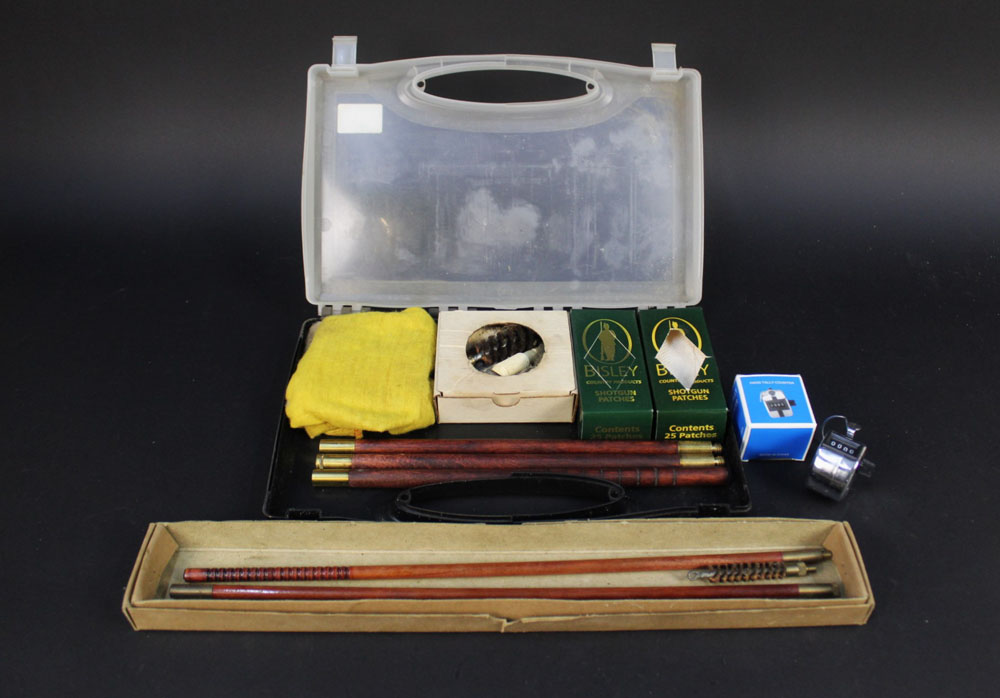 A Bisley 12 bore cleaning kit, together with a 410 cleaning kit and a hand tally counter.