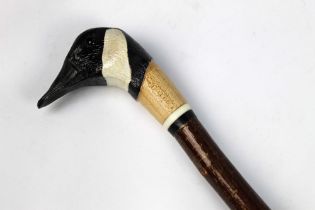 A walking stick with carved wooden handle in the form of a Canadian goose, length 127 cm.