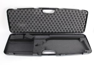 Bettinsoli a hard plastic shotgun case with space for 31" barrels.