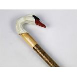 A walking stick with carved wooden handle in the form of a swan. Length 123 cm.