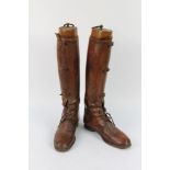 A pair of ladies tan leather riding boots,
