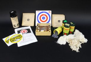 A quantity of vintage air gun targets, pellets, air gun oil, two vintage Air Gun World stickers.