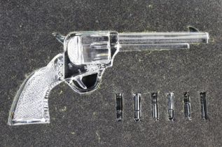 A Waterford Crystal revolver and six cartridges,