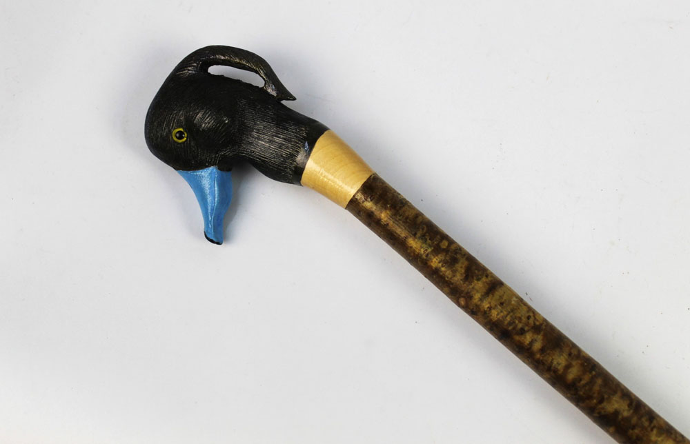 A walking stick with wooden handle carved in the form of a tufted duck. Height 131 cm.