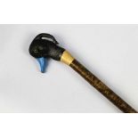 A walking stick with wooden handle carved in the form of a tufted duck. Height 131 cm.