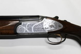 A Rizzini 12 bore over/under shotgun, with 27" multi choke barrels, comes with four chokes,