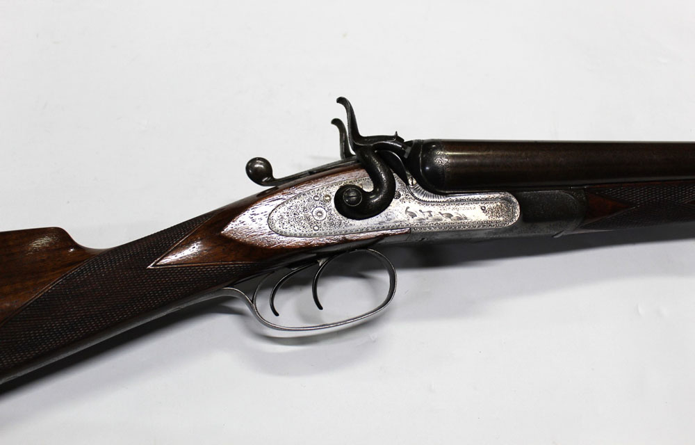 James Squires London, a 12 bore side by side hammer gun with 29 3/4" Damascus barrels,