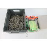 A box of Octopus bait sea fishing lures, and a box of large sea fishing hooks.