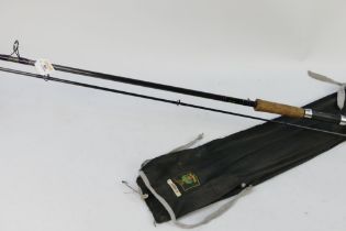 A Daiwa Whisker spinning rod, in two sections 11'.