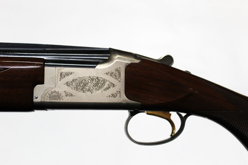 A Browning Citori shotgun, made in Japan by Maroku with two sets of barrels, the first 20 bore,