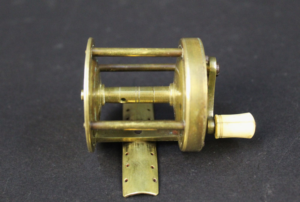 An Ustonson brass pole winch fishing reel, marked to the side Ustonson maker to His Majesty, - Image 4 of 5