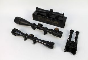 A Chinese bipod and three telescopic sights (scopes).