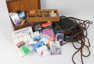 A wooden tackle box containing various sea fishing Riggs, lures etc, to include Tope traces,