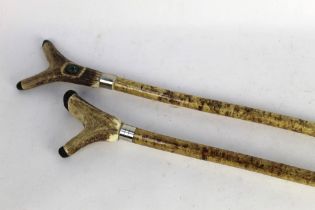 Two hazel shafted walking sticks, first with inset compass on stag antler handle,