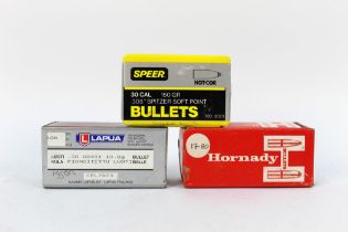 Three boxes of bullet heads, to include Hornady 308 bullet heads,