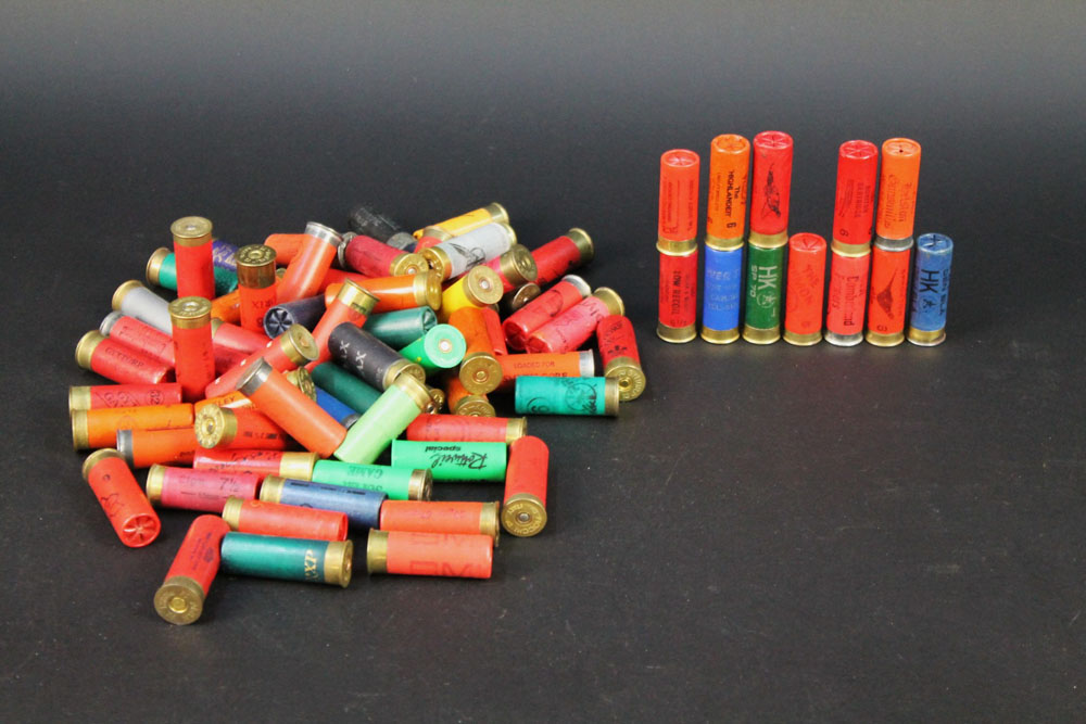 A box containing seventy five 12 bore shotgun cartridges, to include paper and plastic cases,