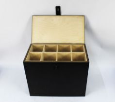 A black powder storage box, with eight internal compartments.