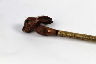 A walking stick with carved wooden handle in the form of a hare, length 127 cm.