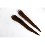 Taxidermy - Two otter poles or rudders,