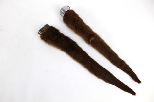 Taxidermy - Two otter poles or rudders,