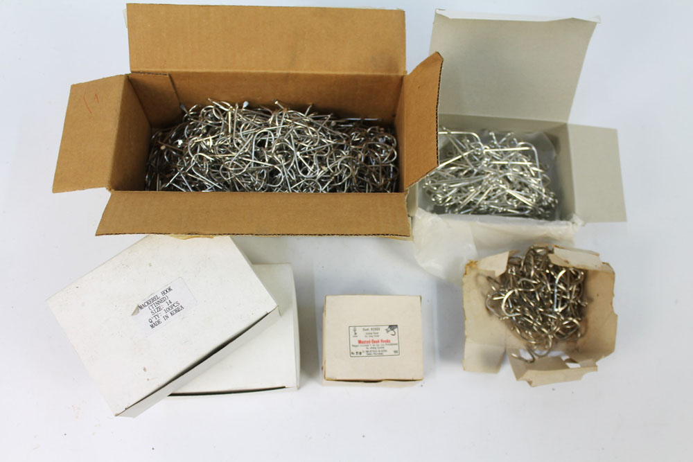 A large quantity of sea fishing hooks, to include Mustad beak hooks.