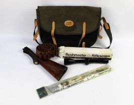 A Jack Pyke game bag containing a Bushmaster scope, shotgun stock, cartridge belt,