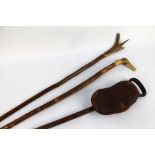 A vintage shooting stick by Mills with leather seat,