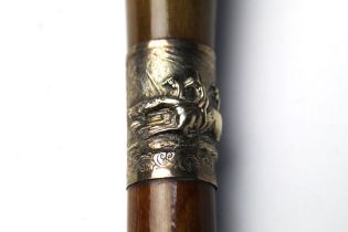 A walking stick with wooden handle and shaft,