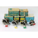 Four Penn multipliers and five Penn reel boxes.