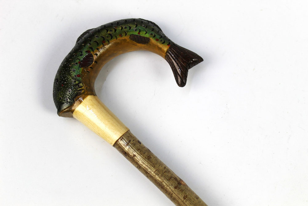 A walking stick with carved wooden handle in the form of a trout, length 127 cm.