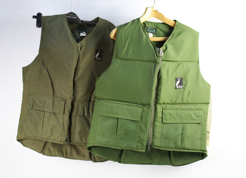 Two Heron anglers buoyancy vests, one Size M the other Size L.