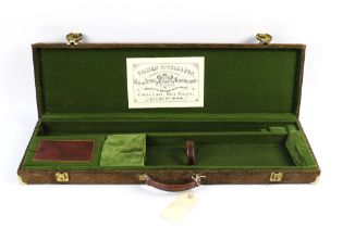 A suede shotgun motor case opening to a green lined interior, suitable for 30" barrels,