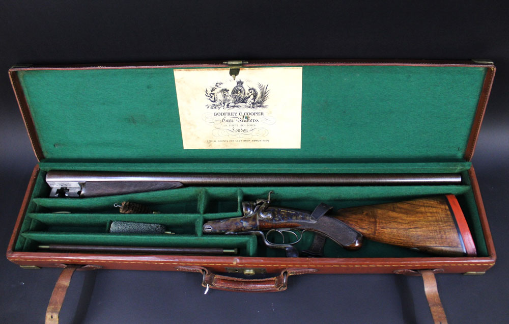 Godfrey C Cooper an 8 bore double barrelled rotary underlever hammer gun, with 35" Damascus barrels,