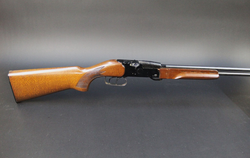 A Mannuarm 410 over/under shotgun, with 26 3/4" barrels,