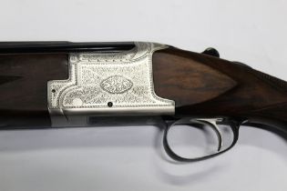 A Laurona 12 bore over/under shotgun, with 17 1/2" barrels, multi choke, comes with four chokes,