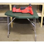 An MTM Case-Gard folding shooting table, together with a Predator shooting rest.