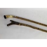 Two hazel shafted walking sticks, first with antler handle,