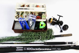 A tackle box containing Abu Garcia Tobys, various Devon Minnows,