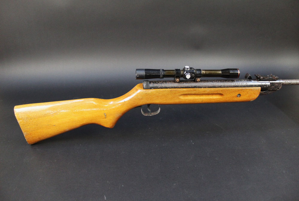 A cal 22 break barrel air rifle, possibly Chinese, fitted with a telescopic sight (scope),