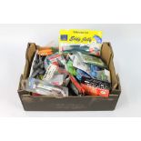 A box containing a large quantity of sea fishing weights, Riggs, to include Octopus bait,