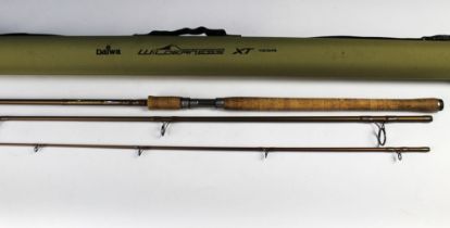 A Daiwa Wilderness XT spinning rod, in three sections. 3.35 meters.