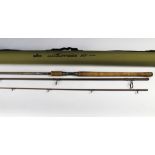 A Daiwa Wilderness XT spinning rod, in three sections. 3.35 meters.