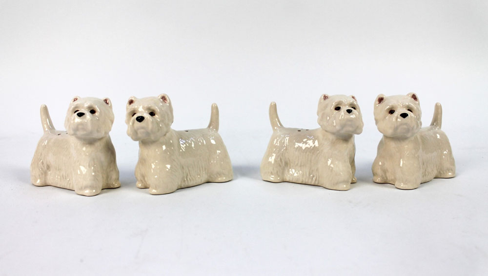 Two pairs of Quail Pottery salt and pepper shakers, both set in the form of West Highland Terriers.