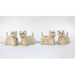 Two pairs of Quail Pottery salt and pepper shakers, both set in the form of West Highland Terriers.