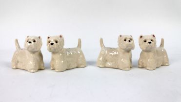 Two pairs of Quail Pottery salt and pepper shakers, both set in the form of West Highland Terriers.