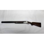 A Rizzini 12 bore over/under shotgun, with 28" barrels, half and quarter choke, 70 mm chambers,