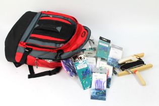 A rucksack containing a large quantity of Fladen sea fishing feathers, squid bait fishing lures etc.