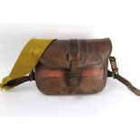 A vintage leather cartridge bag, marked to the exterior Registered Design No.