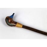 A walking stick with carved wooden handle in the form of a teal, length 123 cm.